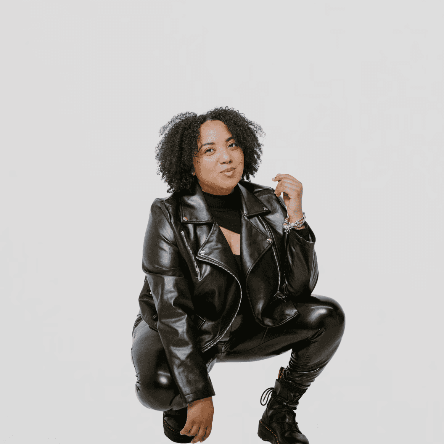 Portrait of Faraja, a professional stylist at The Gloss Society, showcasing their expertise and style.