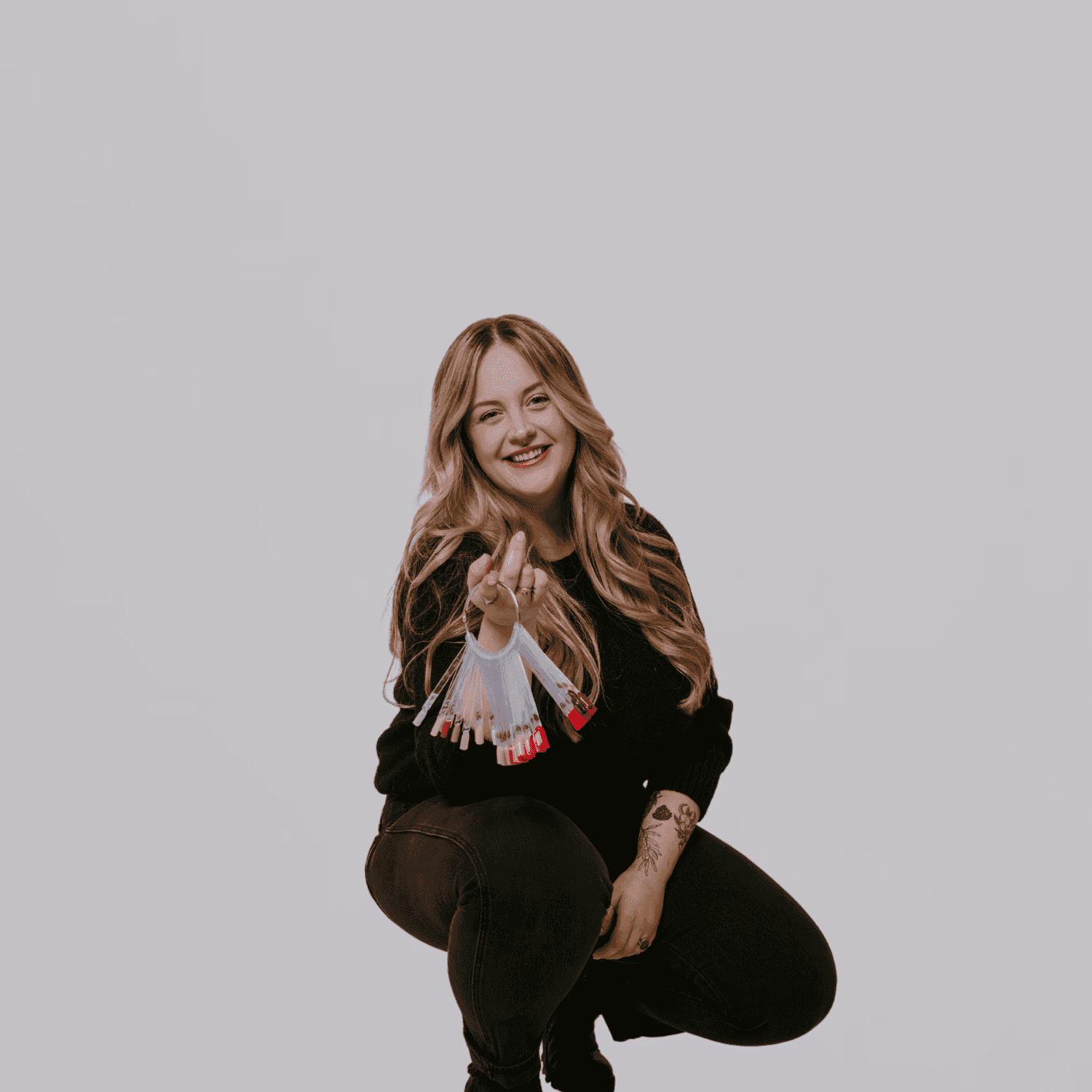 Portrait of Kassy, a professional stylist at The Gloss Society, showcasing their expertise and style.