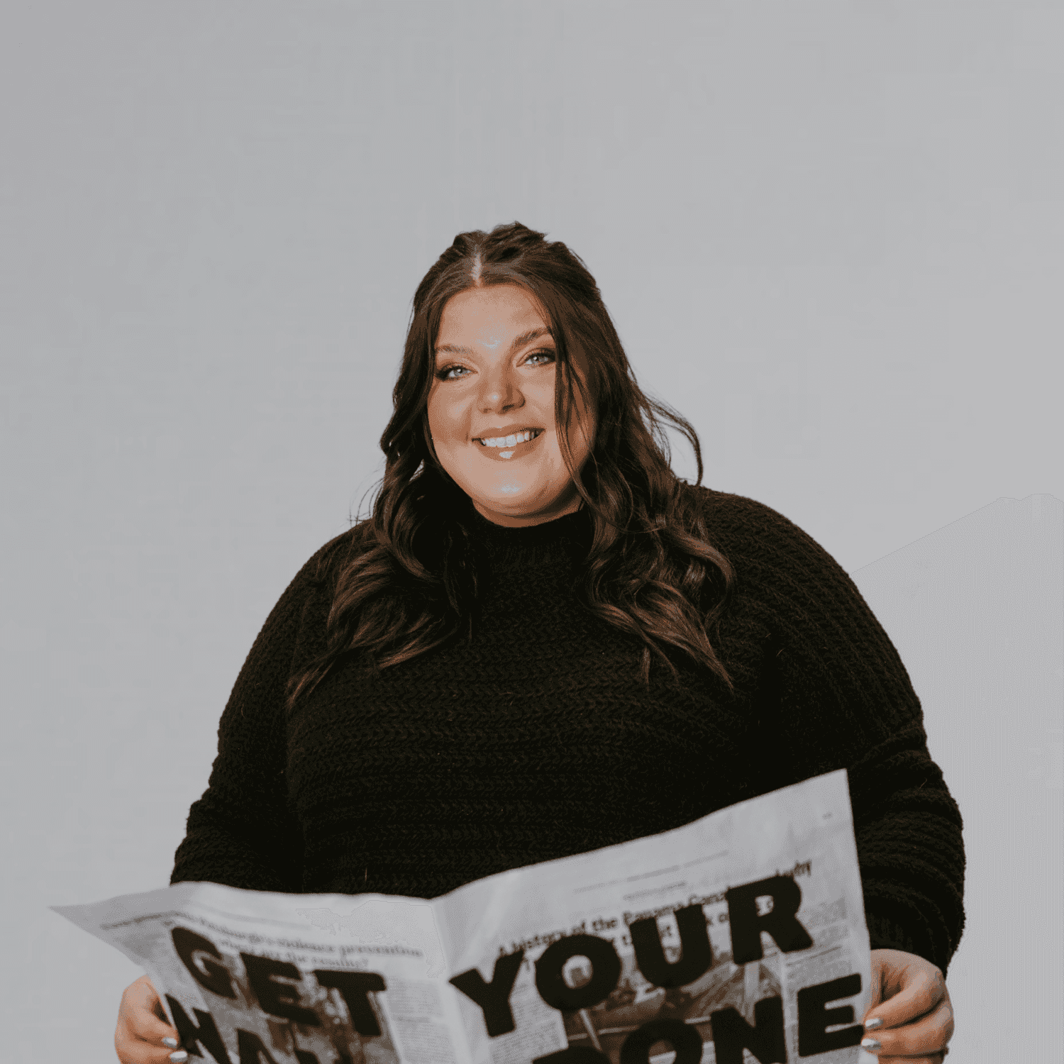 Portrait of Danielle "D", a professional stylist at The Gloss Society, showcasing their expertise and style.